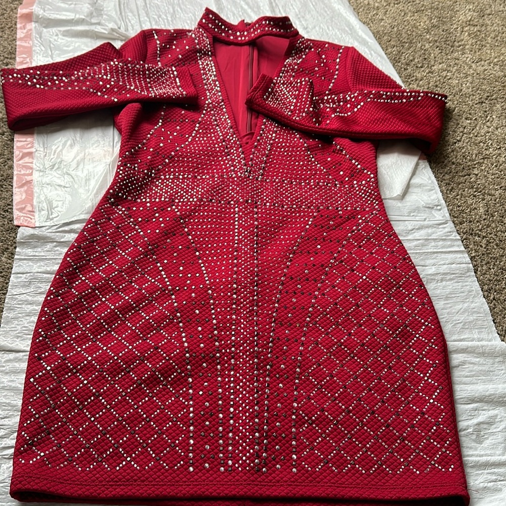 Red turtlenecked dress from Bebe with rhinestones. Size L.